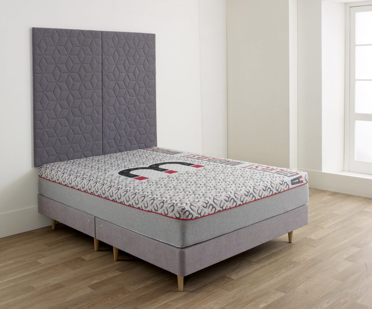 Magnerest mattress with a grey headboard