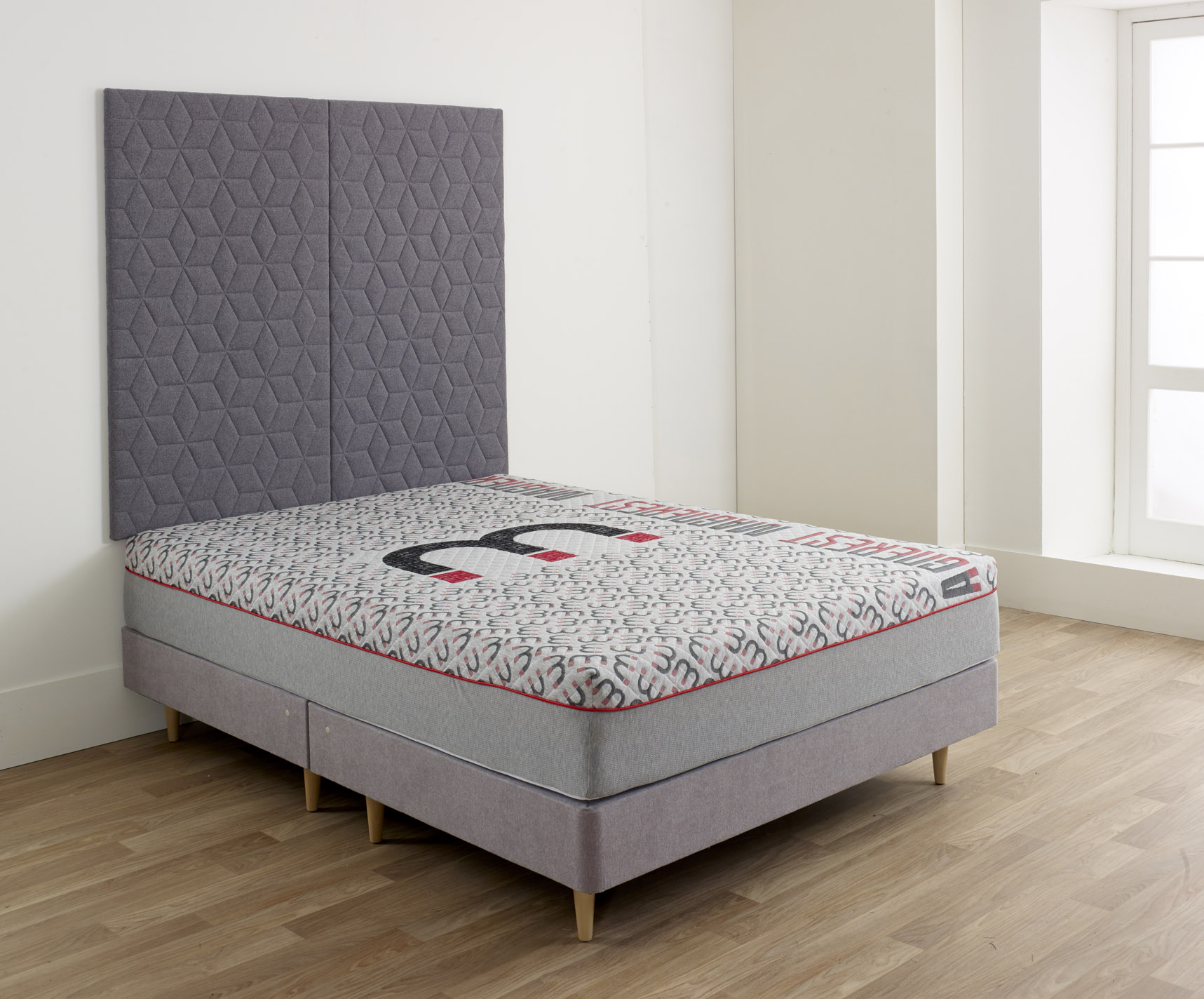 Magnerest mattress with a grey headboard